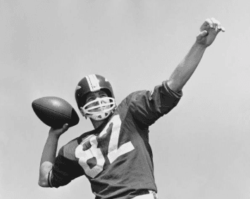 Black-and-white photo of a high-school sports team from the 1960s