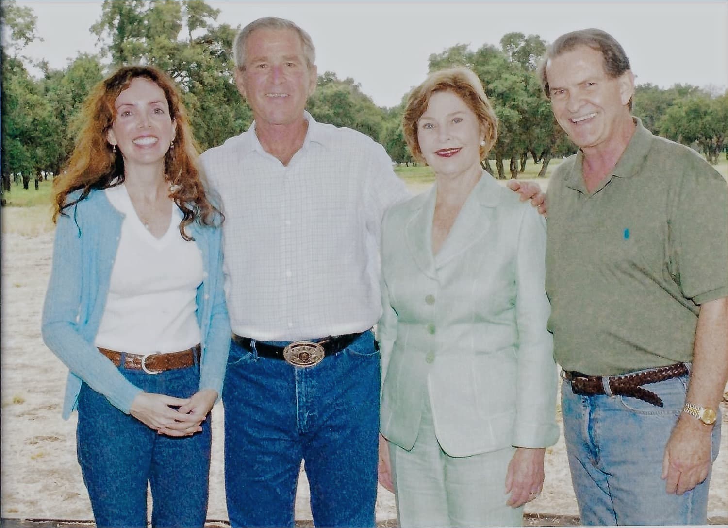 Joseph Cox standing outdoors with President George W. Bush and Mrs. Laura Bush